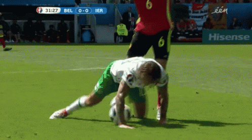 Soccer Player Number 6 Laying on Ground
