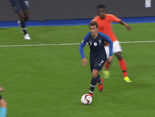 Soccer Player Number 7 Kicking Ball