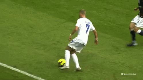 Soccer Player Number 7 Kicking Ball