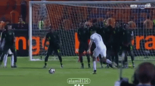 Soccer Player Number 7 Kicks Ball