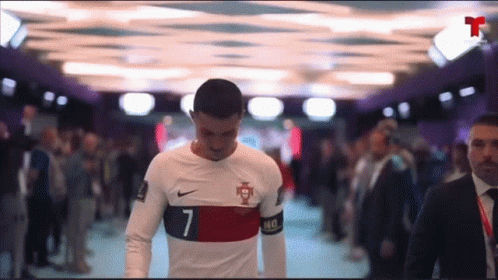 Soccer Player Number 7 Walking Through Crowd