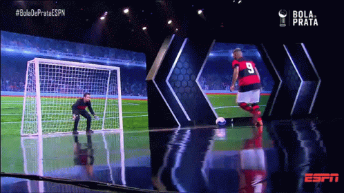 Soccer Player Number 9 Kicking Soccer Ball