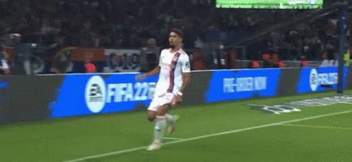 Soccer Player on Field with FIFA 22 Ads