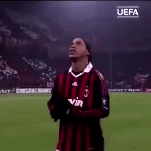 Soccer Player on Field With UEFA Logo