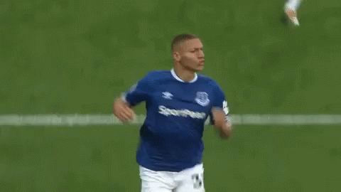 Soccer Player Running in Blue and White Jersey