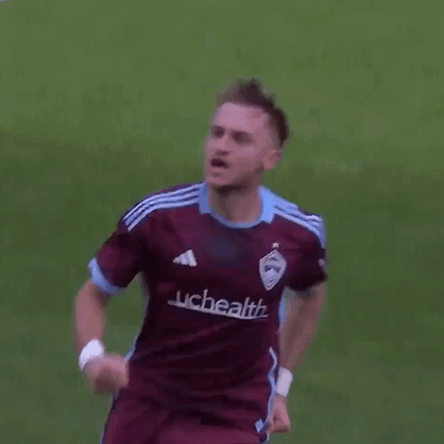 Soccer Player Running in Maroon Adidas Jersey