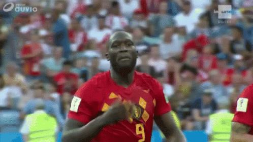 Soccer Player Running in Red Jersey Number 9