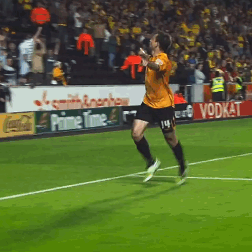 Soccer Player Running in Yellow Shirt