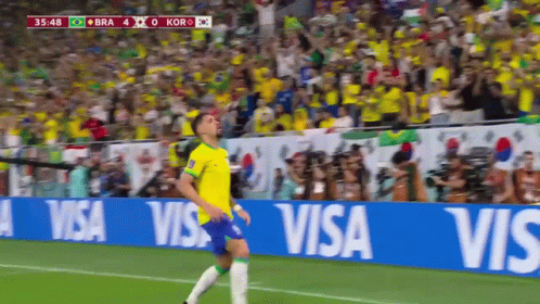 Soccer Player Running on Field