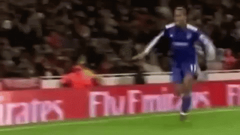Soccer Player Running on Field