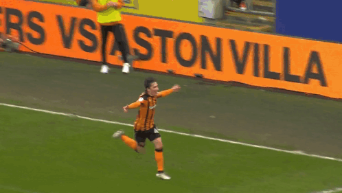 Soccer Player Running Past Ston Villa Sign