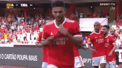 Soccer Player Running Red Emirates Fly Better Jersey
