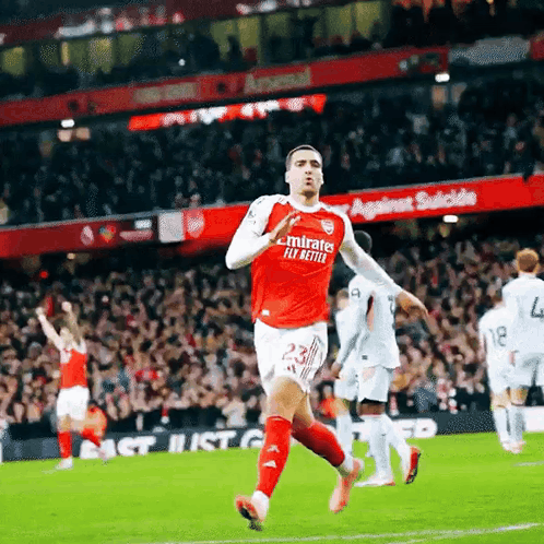 Soccer Player Running Red Jersey Emirates Fly Better