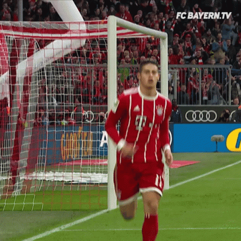 Soccer Player Running Towards Goal FC Bayern.tv Logo