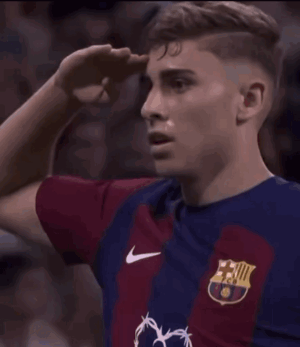 Soccer Player Saluting Crowd in Nike Jersey