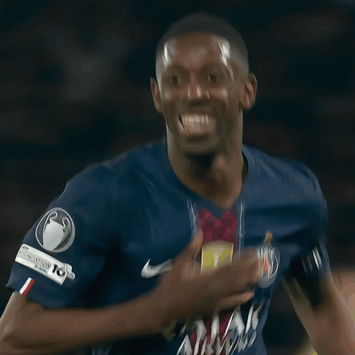 Soccer Player Smiling in Bein Jersey