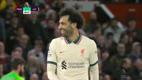 Soccer Player Smiling In Standard Chartered Jersey GIF