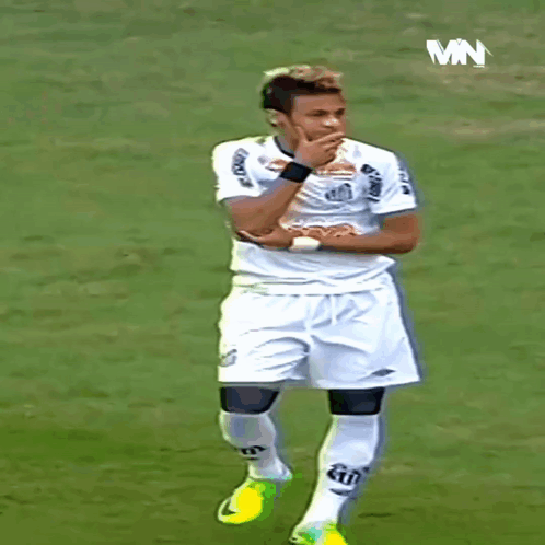 Soccer Player Standing on Field with MN