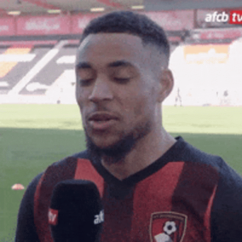Soccer Player Talking Into Microphone