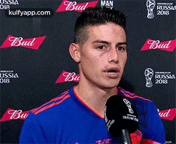 Soccer Player Talking Into Microphone At Budweiser Banner GIF