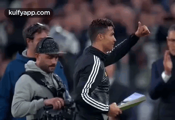 Soccer Player Thumbs Up Holding Clipboard