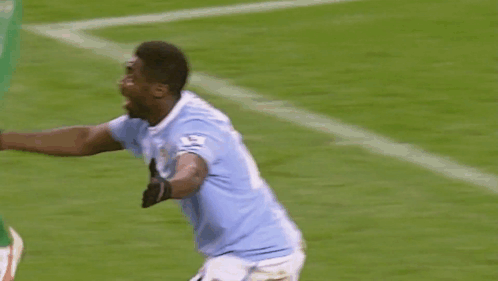 Soccer Player Thumbs Up on Field
