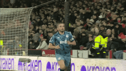 Soccer Player Wearing BMS Shirt Running