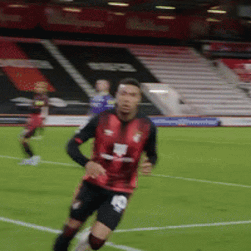 Soccer Player Wearing Red Jersey Number 10