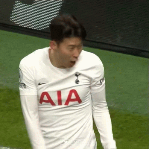 Soccer Player Wearing White AIA Shirt