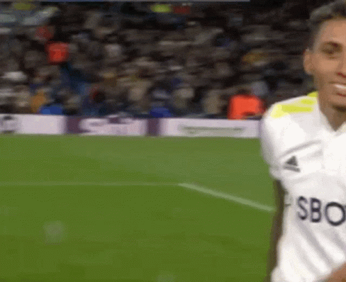 Soccer Player Wearing White SBC Shirt