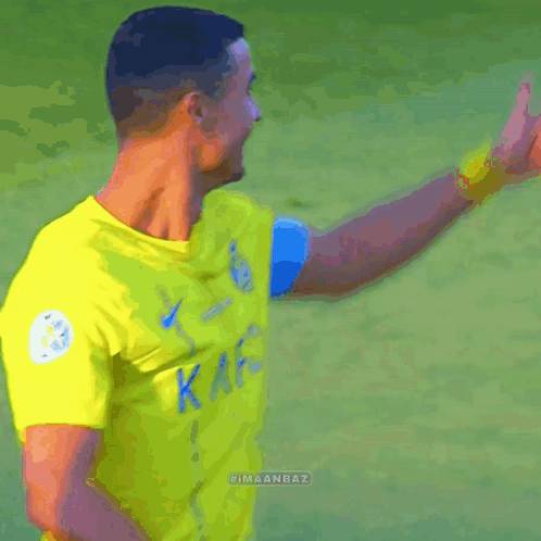 Soccer Player Wearing Yellow KAFC Jersey