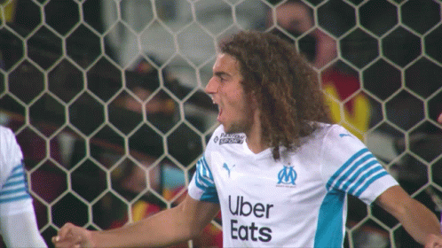 Soccer Player With Curly Hair and Uber Eats Shirt