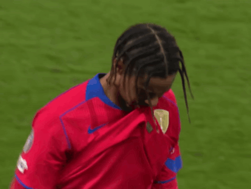 Soccer Player With Dreadlocks In Red Jersey GIF