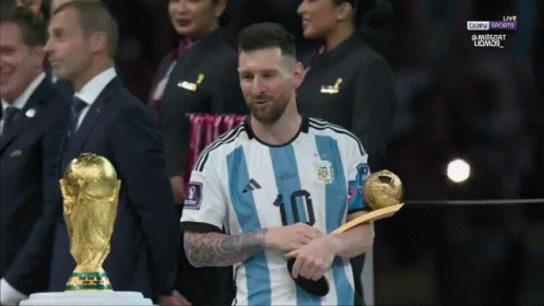 Soccer Player With Number 10 Holding Trophy