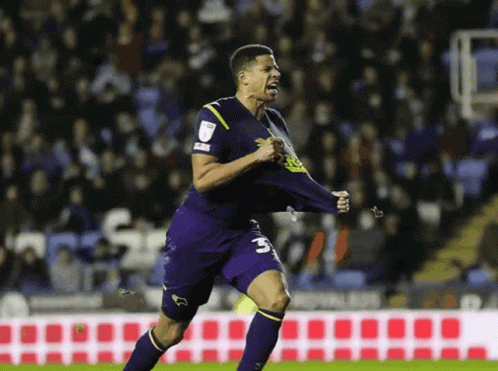 Soccer Player with Number 3 on Shorts Celebrating