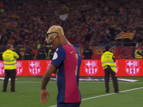 Soccer Player With Sunglasses on Field With Crowd