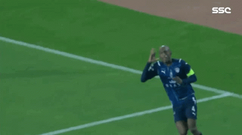 soccer players are celebrating a goal on a field with the ssc logo in the corner