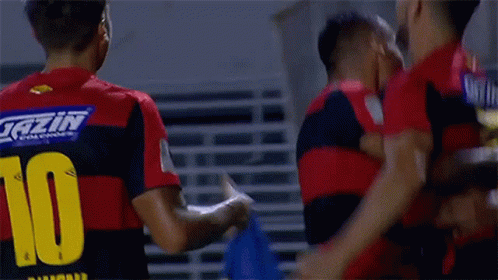 Soccer Players Celebrating Goal Number 10