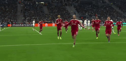 Soccer Players Celebrating Goal Sponsored by Mastercard