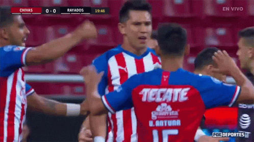 Soccer Players Celebrating Goal with Tecate Jersey
