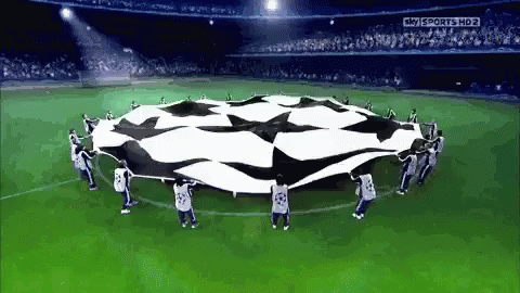 Soccer Players Holding Flag in Circle