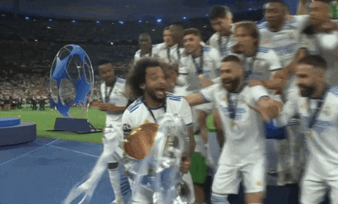 Soccer Players Holding Trophy