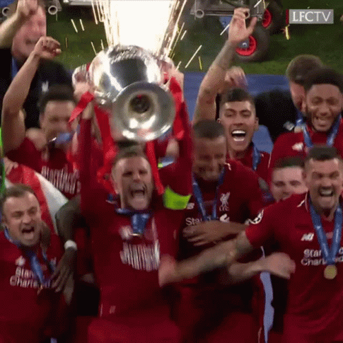 Soccer Players Holding Trophy Celebrating