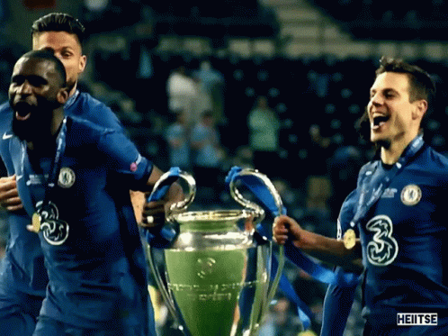 Soccer Players Holding Trophy with Number 3