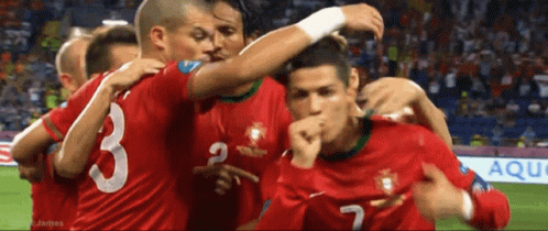 Soccer Players Huddle Around Number 3