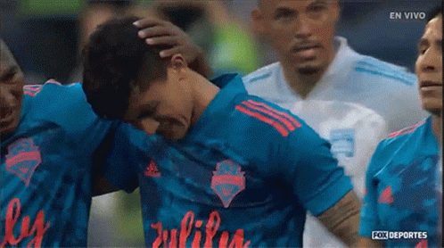 Soccer Players Huddled With Julius Jersey GIF