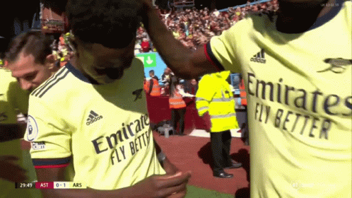 Soccer Players Hugging In Emirates Jerseys GIF