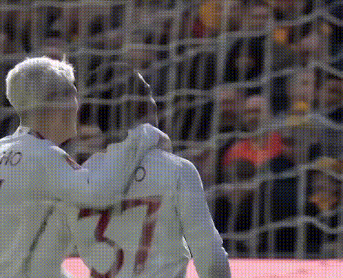 Soccer Players Hugging Number 37