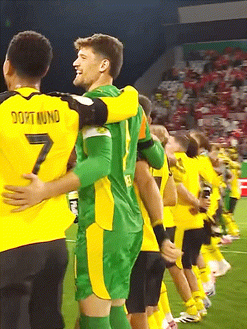 Soccer Players Hugging Number 7