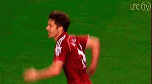 Soccer Players Hugging on Field